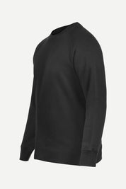 Black Crew Neck Sweatshirt Series IX, angled view with ribbed collar and raglan sleeve